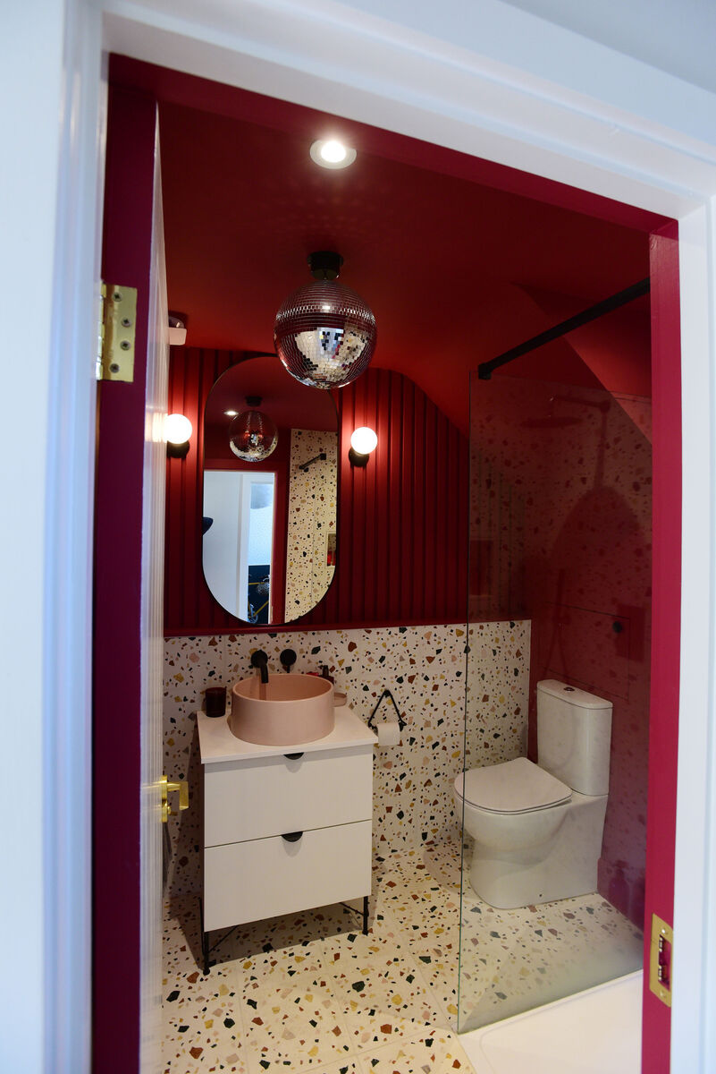 Updating a plain vanity with new hardware, as Jennifer Sheahan has in her downstairs bathroom, gives it new life. Picture: Moya Nolan Updating a plain vanity with new hardware, as Jennifer Sheahan has in her downstairs bathroom, gives it new life. Picture: Moya Nolan