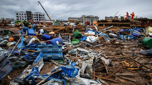 Rescuers conduct work at a tornado-hit logistics park in the Huangzhou district of Huanggang City in central China’s Hubei Province (Xinhua via AP)