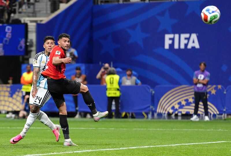 Argentina's Enzo Fernandez scores their side's third goal of the game. Pic: Martin Rickett/PA Wire. Argentina's Enzo Fernandez scores their side's third goal of the game. Pic: Martin Rickett/PA Wire.