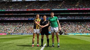 <p>MAN IN THE MIDDLE: Kilkenny's Richie Reid, Referee Colm Lyons and Limerick's Declan Hannon ahead of the 2022 All Ireland final. Pic: ©INPHO/James Crombie.</p>