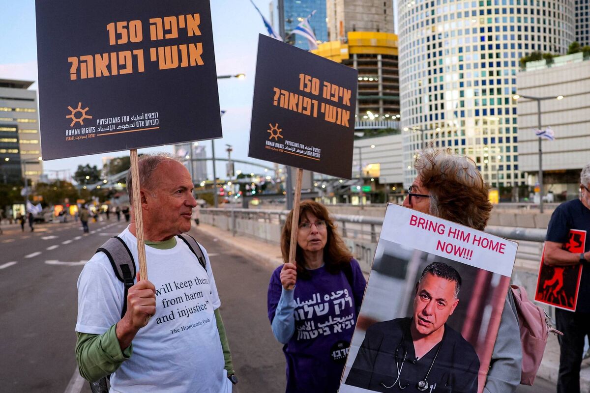 A demonstrator holds a sign depicting Israeli-detained Palestinian paediatrician Hussam Abu Safiya outside the Israeli Defence Ministry headquarters in Tel Aviv in April 2025. File picture: Jack Guez/Getty Images