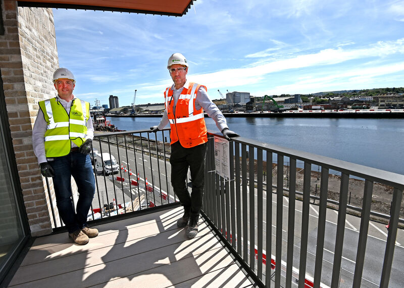 Phelim O'Neill, (left) director of development LPA and Sean McGinley, construction director BAM on the balcony of a two bed at Horgan's Quay apartments, overlooking The River Lee. Picture: Eddie O'Hare Phelim O'Neill, (left) director of development LPA and Sean McGinley, construction director BAM on the balcony of a two bed at Horgan's Quay apartments, overlooking The River Lee. Picture: Eddie O'Hare