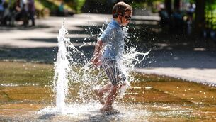 <p>Children play in a fountain in England as Europe sees temperatures continue to rise. Picture: David Davies/PA</p>