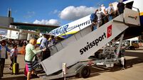 Passengers embarking on a Ryanair Airbus A320 aircraft