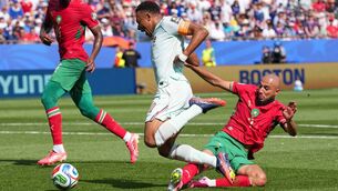 <p>France's Kylian Mbappe is fouled by Morocco's Noussair Mazraoui during the World Cup quarter final match between France and Morocco. Picture: Martin Meissner/AP</p>