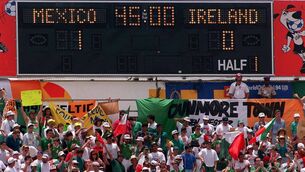<p>BOYS IN GREEN: Ireland fans below the scoreboard at half-time during the World Cup 1994 Group E match against Mexico in Orlando. It proved to be a tough game for Ireland. Pic: David Maher/Sportsfile</p>