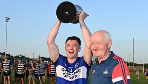 <p>FOUR-IN-A-ROW: Sarsfields' Jack O'Connor raises the Denis Conroy cup with Pat Horgan, chairman Cork county board. Pic: Eddie O'Hare.</p> <p>FOUR-IN-A-ROW: Sarsfields' Jack O'Connor raises the Denis Conroy cup with Pat Horgan, chairman Cork county board. Pic: Eddie O'Hare.</p>