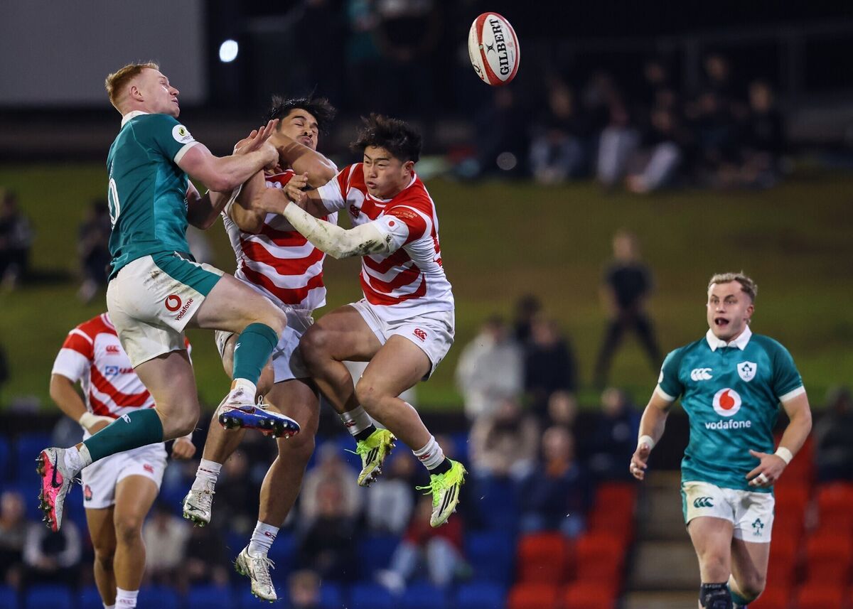 Ireland's Ciaran Frawley challenges for the high ball against Japan's Dylan Riley and Kazuma Ueda. Pic: ©INPHO/Ben Brady.