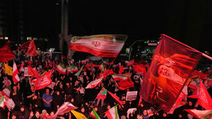 Pro-government demonstrators wave Iranian and religious flags in a gathering commemorating the late Iranian Supreme Leader Ayatollah Ali Khamenei (Vahid Salemi/AP) Pro-government demonstrators wave Iranian and religious flags in a gathering commemorating the late Iranian Supreme Leader Ayatollah Ali Khamenei (Vahid Salemi/AP)