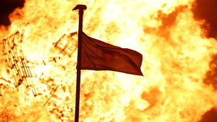<p>A bonfire burns at Roden Street in Belfast as part of events marking the Twelfth of July. Picture: Liam McBurney/PA</p>
