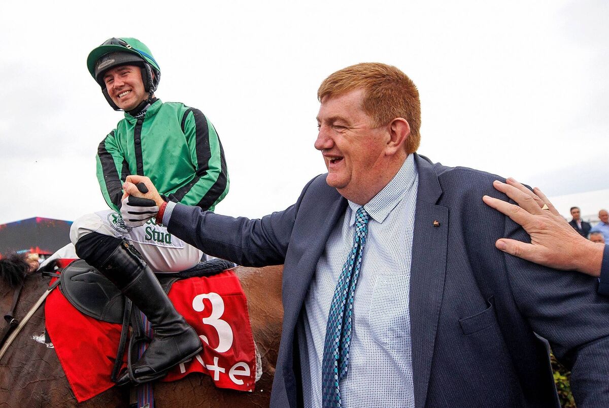 Jordan Gainford celebrates with trainer John ‘Shark’ Hanlon after with won the Galway Plate with Hewick in 2022 Photo: ©INPHO/James Crombie