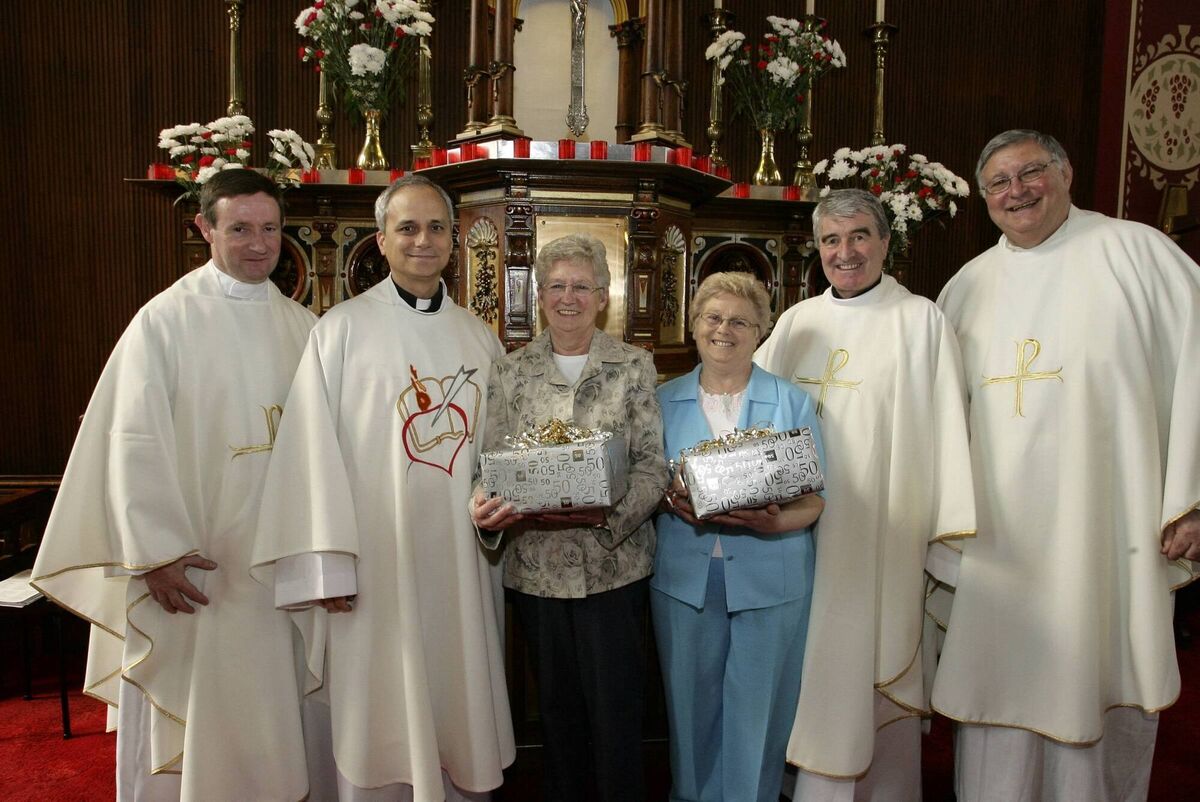 St Augustine's Church choir mistress Peg Bolton and choir member Marie Finn were honoured for their 50 years in the choir during a visit to Cork in 2007 by Robert Prevost — now Pope Leo XIV — alongside his fellow Augustinians, Fr Jerry Horan, Fr Pat Moran, and Fr Michael Brennock. Picture: Gerard Bonus