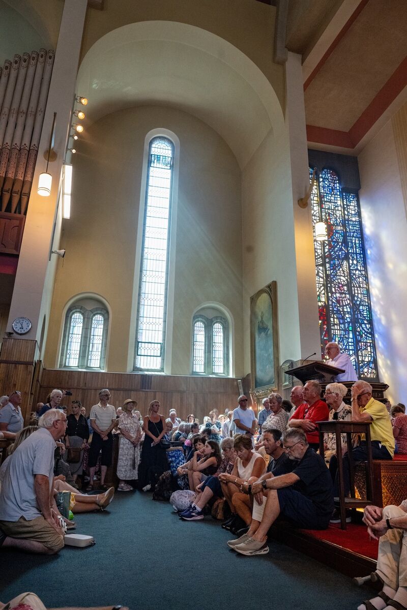 Readings are delivered as the congregation occupied every available space inside the packed St Augustine’s Church in Cork on Sunday. Picture: Chani Anderson