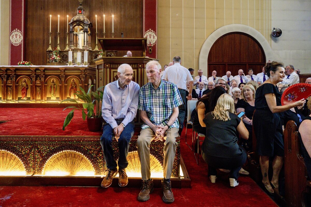  The congregation found every available space to sit in St Augustine’s Church for its final Mass amid the soaring temperatures. Picture: Chani Anderson