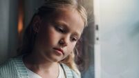 Anxiety, thinking and window with child in home for mental health, adoption crisis or stress. Mistake, foster care trauma and ab