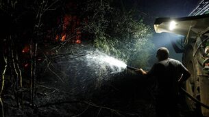 <p>A farmer spraying water in the forest of Fontainebleau, after a forest fire broke out late afternoon in Noisy-sur-Ecole on July 12. Picture: GEOFFROY VAN DER HASSELT / AFP via Getty Images)</p> <p>A farmer spraying water in the forest of Fontainebleau, after a forest fire broke out late afternoon in Noisy-sur-Ecole on July 12. Picture: GEOFFROY VAN DER HASSELT / AFP via Getty Images)</p>