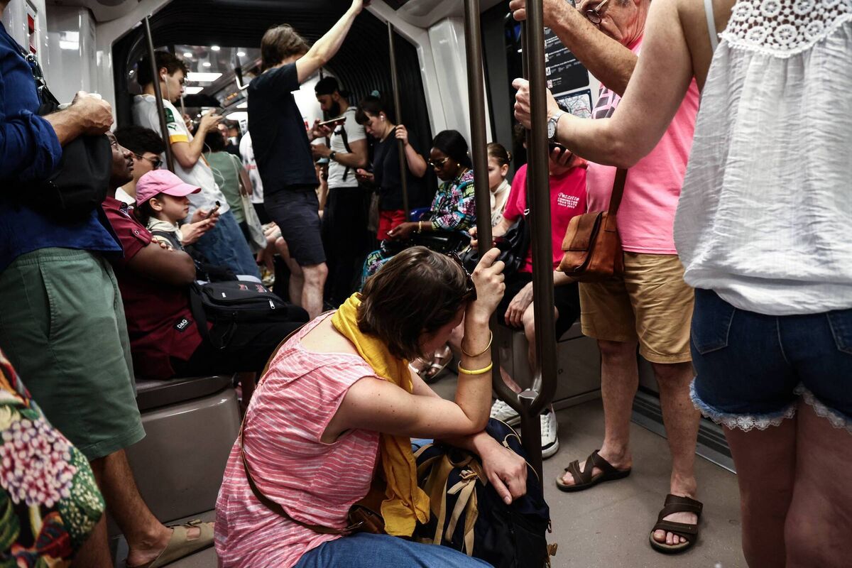 A woman sits on the floor of a crowded carriage on metro line 11 during the heatwave in Paris last month. The extreme heatwave at the end of June disrupted power supplies, shut schools, and smashed temperature records in France, Spain and the UK. Photo: Gauthier Bedrignans/Hans Lucas/AFP via Getty Images A woman sits on the floor of a crowded carriage on metro line 11 during the heatwave in Paris last month. The extreme heatwave at the end of June disrupted power supplies, shut schools, and smashed temperature records in France, Spain and the UK. Photo: Gauthier Bedrignans/Hans Lucas/AFP via Getty Images