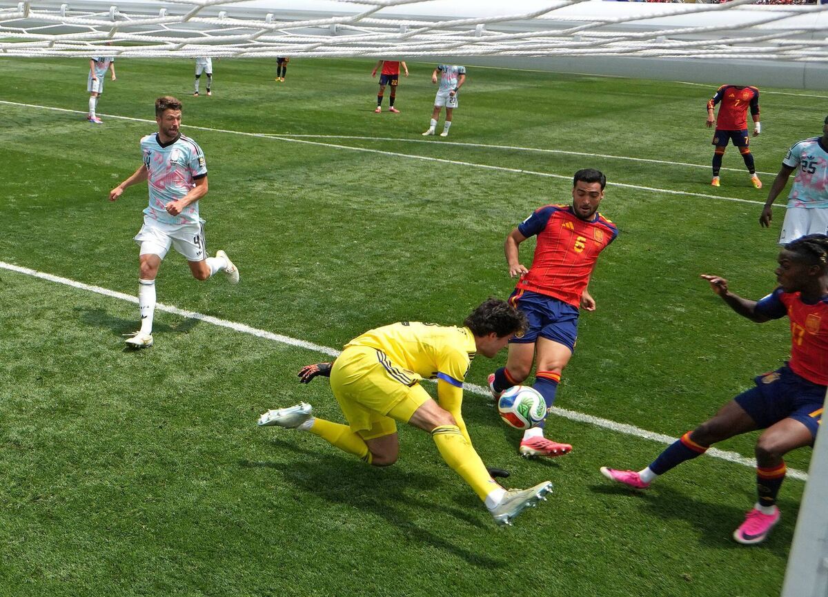 Senne Lammens spills the ball into the path of Mikel Merino who scores to put Spain into the semi finals. Pic: David Ramos/Getty Senne Lammens spills the ball into the path of Mikel Merino who scores to put Spain into the semi finals. Pic: David Ramos/Getty