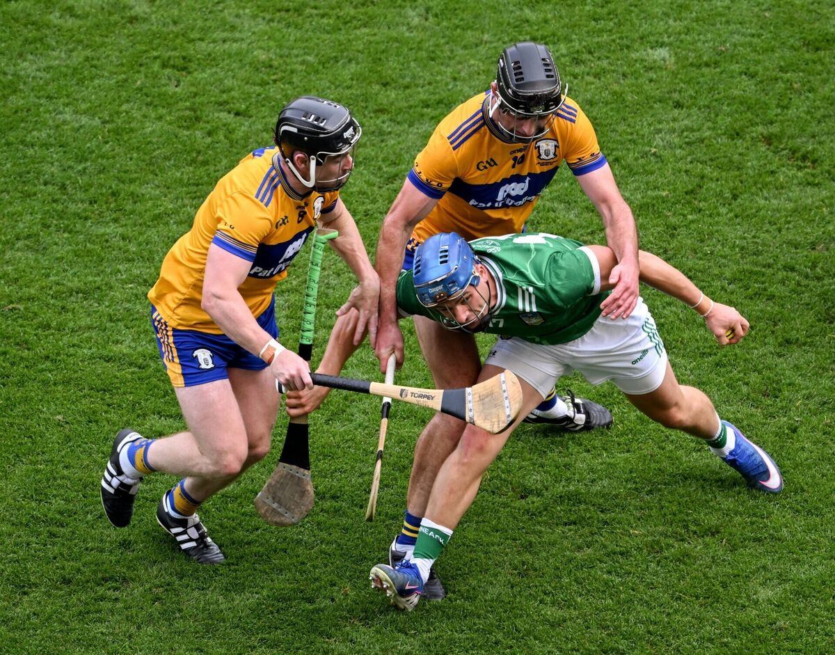 Mike Casey in action against Tony Kelly, left, and Cathal Malone of Clare in the semi-final. Pic: Daire Brennan/Sportsfile