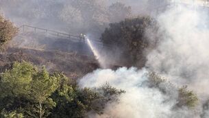 <p>Firefighters battling the blaze near Crosshaven. Picture: Rory Conlon</p> <p>Firefighters battling the blaze near Crosshaven. Picture: Rory Conlon</p>