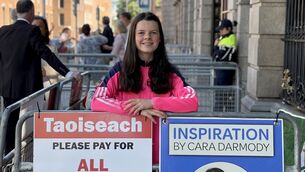 <p>Teenage activist Cara Darmody begins a 50-hour protest outside Leinster House over the delays families and children face in accessing assessments of need. Picture: Gráinne Ní Aodha/PA Wire</p>