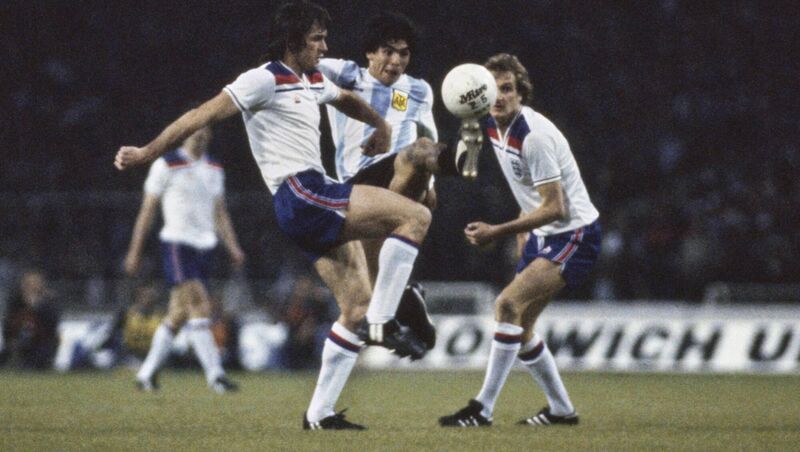 England players Dave Watson and Phil Thompson in action with Diego Maradona. Pic: Duncan Raban/Allsport/Getty Images/Hulton Archive. England players Dave Watson and Phil Thompson in action with Diego Maradona. Pic: Duncan Raban/Allsport/Getty Images/Hulton Archive.