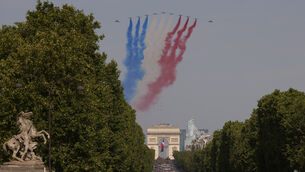 Jets from the acrobatic Patrouille de France fly during the Bastille Day military parade on the Champs-Elysees in Paris on Tuesday (Thomas Padilla/AP)