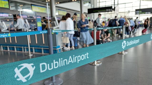 <p>Passengers queuing at Dublin Airport. The Irish Aviation Authority has proposed to cut passenger charges at Dublin Airport by 15% next year, with Ryanair responding that it could mean an extra 2m passengers added but the airport operator DAA warning it risks further investment in facilities. Picture: Dominic McGrath/PA Wire</p>