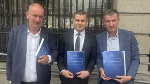 <p>Jason Clancy, solicitor Darragh Mackin and Colin Power (Bairbre Holmes/PA)</p>