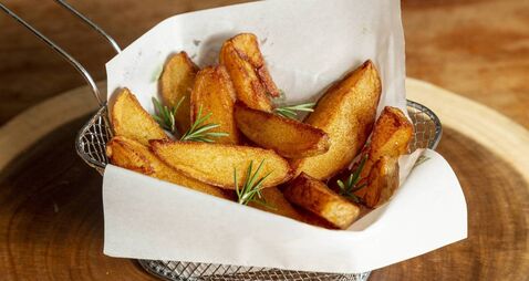 Portion of fried rustic potatoes