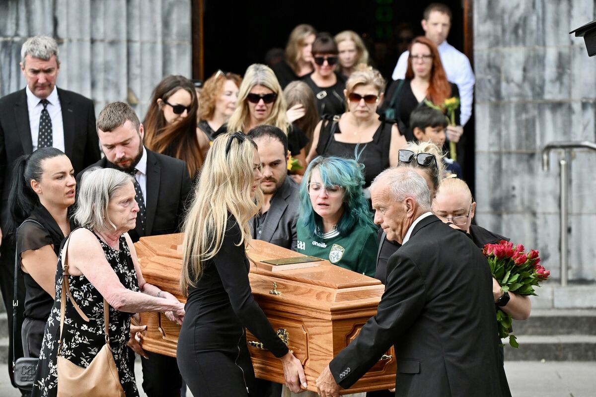 Kathleen mother of Jamey and Devon, sister of the deceased Jamey Carney and mourners carry her coffin to the hearse after the requiem mass at St Mary’s Cathedral, Co Kerry. Picture: Larry Cummins Kathleen mother of Jamey and Devon, sister of the deceased Jamey Carney and mourners carry her coffin to the hearse after the requiem mass at St Mary’s Cathedral, Co Kerry. Picture: Larry Cummins