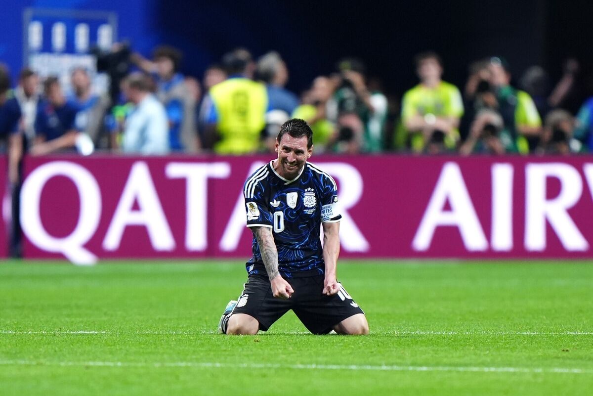 EL CAPITAN; Lionel Messi celebrates at the final whistle, falling to his knees in elation. Pic: Bradley Collyer/PA Wire