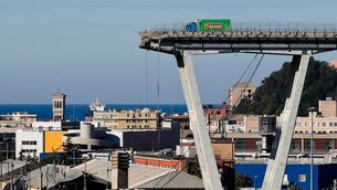A vehicle sits short of a section of the Morandi highway bridge that collapsed (Antonio Calanni/AP) A vehicle sits short of a section of the Morandi highway bridge that collapsed (Antonio Calanni/AP)