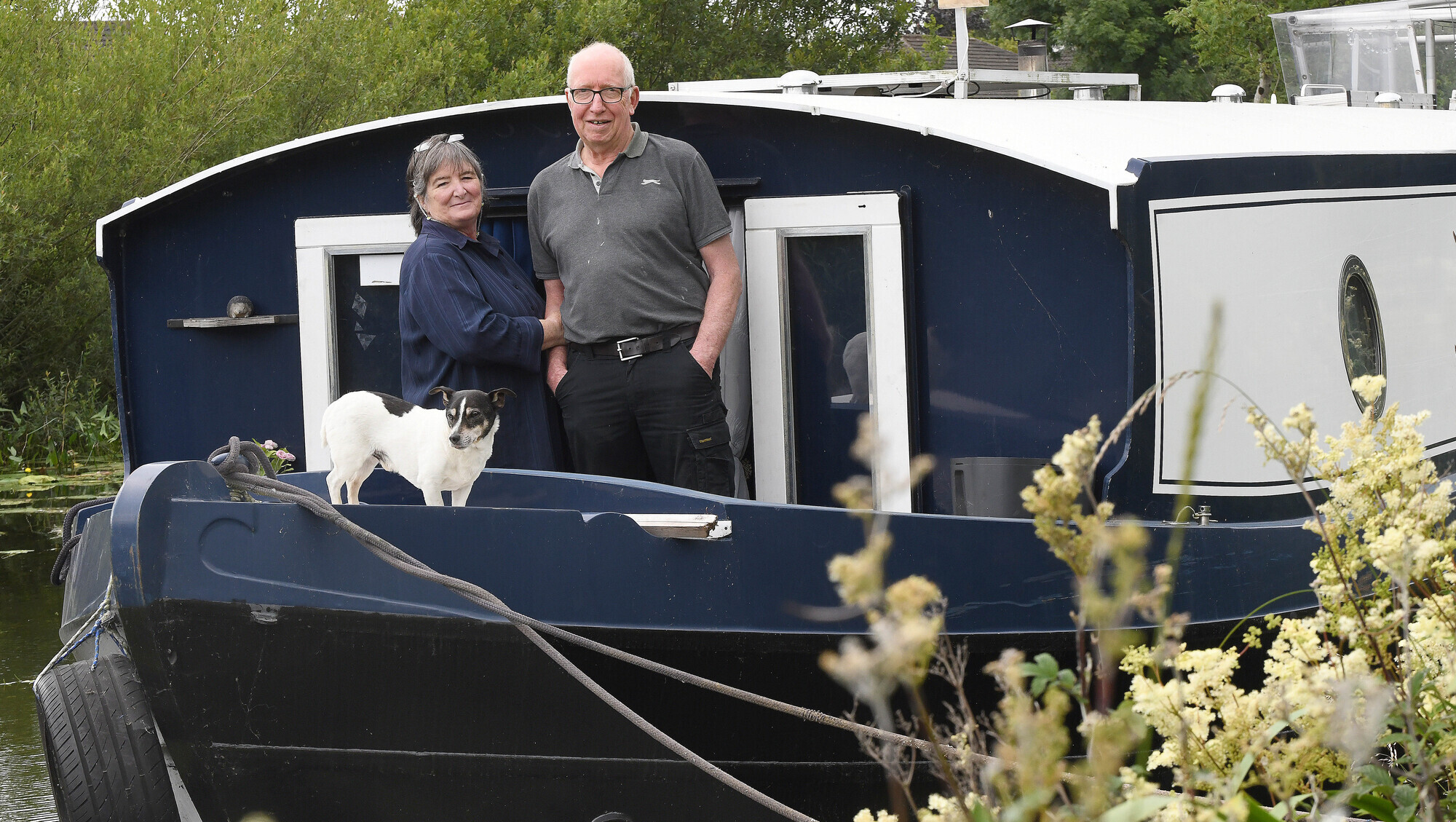 Alistair and Tracey Morrish with their dog Buzz on the barge they call home near Lucan, Co. Kildare. Picture: Moya Nolan