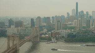 The Brooklyn Bridge as smoke from wildfires blankets the sky over New York (Alyssa Goodman/AP) The Brooklyn Bridge as smoke from wildfires blankets the sky over New York (Alyssa Goodman/AP)