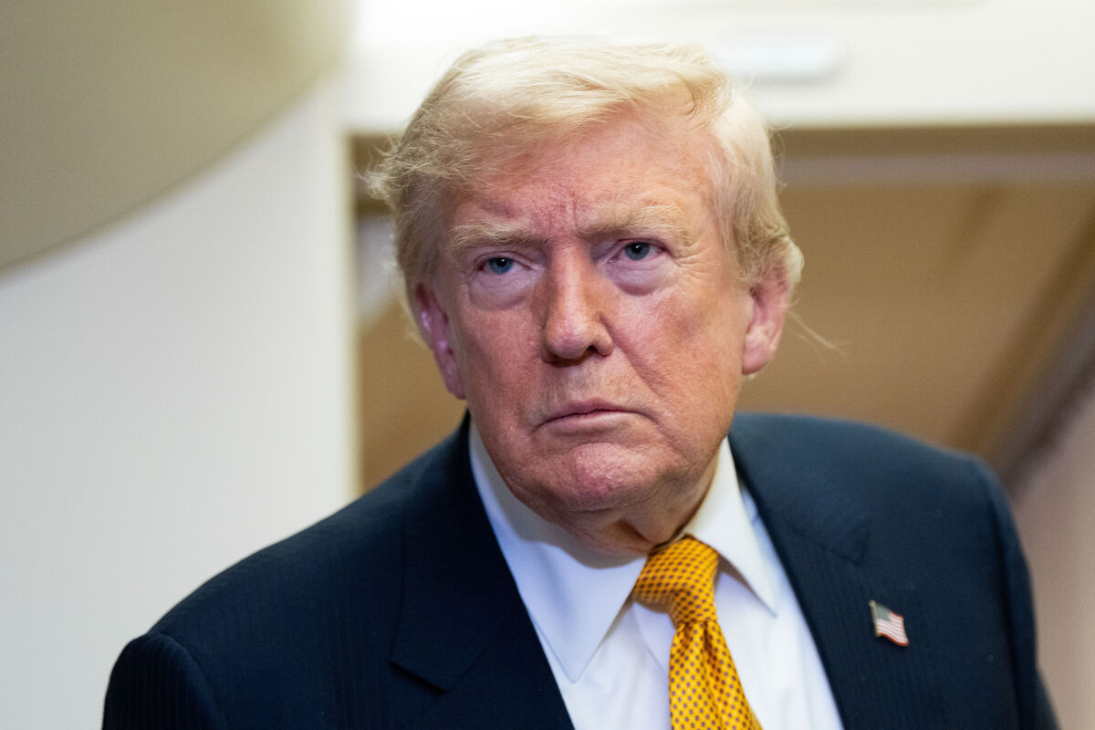 President Donald Trump speaks with reporters in flight on Air Force One. Picture: AP Photo/Alex Brandon