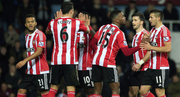 Southampton's Dusan Tadic (right) is congratulated by team mates after scoring the opening goal during the Barclays Premier League match at Upton Park, London. Southampton's Dusan Tadic (right) is congratulated by team mates after scoring the opening goal during the Barclays Premier League match at Upton Park, London.