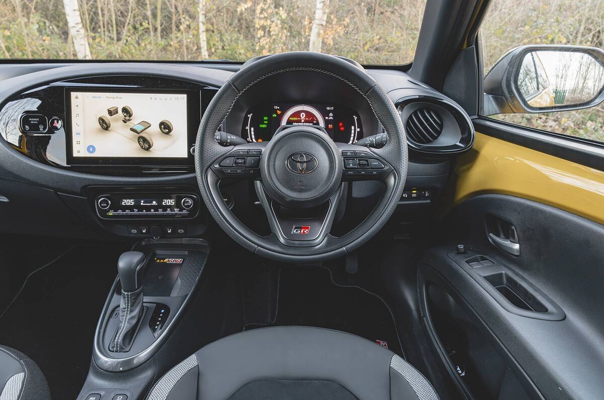 On the inside of the Aygo, there’s a very neat dashboard design, with most of the working bits incorporated in a visually appealing oval-shaped structure. On the inside of the Aygo, there’s a very neat dashboard design, with most of the working bits incorporated in a visually appealing oval-shaped structure.