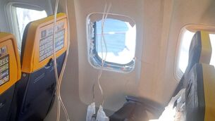<p>The US National Transportation Safety Board said Thursday it will lead the investigation into an incident in which a passenger was partly sucked out of a Ryanair Boeing 737's broken window over Greece last week.</p> <p>The US National Transportation Safety Board said Thursday it will lead the investigation into an incident in which a passenger was partly sucked out of a Ryanair Boeing 737's broken window over Greece last week.</p>