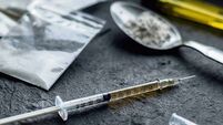Drug Use.jpg drug syringe and cooked heroin on spoon. drug addict problem and therapy concept