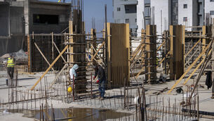 <p>Palestinian laborers work at the site of a new housing project in the West Bank Jewish Settlement of Beit El. (AP Photo/Ohad Zwigenberg, File)</p> <p>Palestinian laborers work at the site of a new housing project in the West Bank Jewish Settlement of Beit El. (AP Photo/Ohad Zwigenberg, File)</p>
