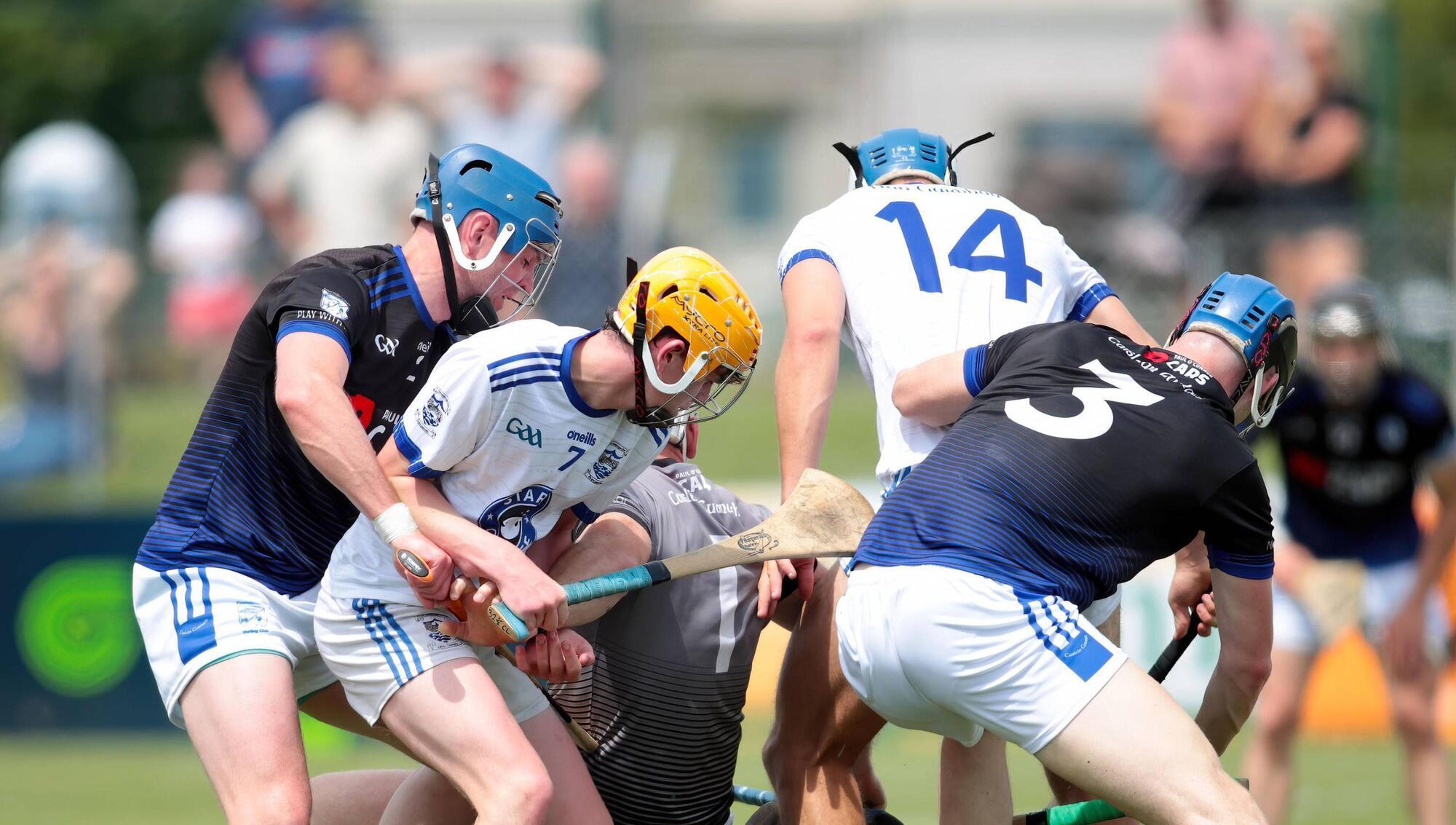 After a scramble for possession in the Fourmilewater penalty area Dungarvans Johnny Burke (No.14) manages to stroke the ball into the net. Pic: Eddie Dee 