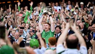 <p>Limerick captain Cian Lynch lifts the Liam MacCarthy Cup. Pic: David Fitzgerald/Sportsfile</p>