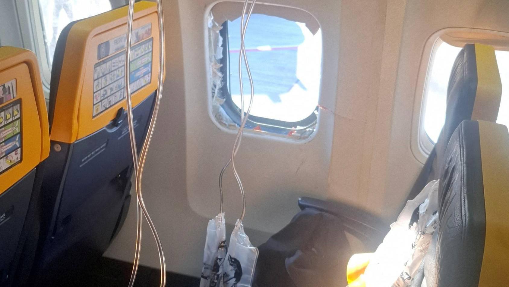 The passenger was sucked out headfirst after an engine failure resulted in parts smashing an acrylic window during a flight from Thessaloniki in Greece to Memmingen, near Munich in Germany.