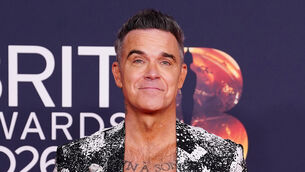 <p>Robbie Williams attending the Brit Awards 2026 (Ian West/PA)</p>