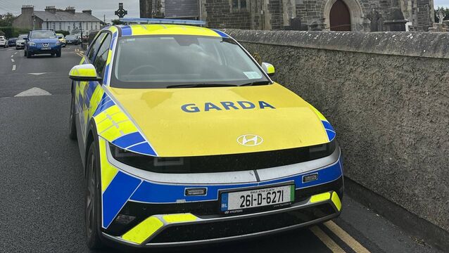 <p>Gardaí at the Holy Cross Church. Photo: Joe Evans.</p>
