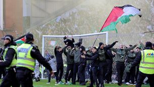 <p>CHARGED: Celtic fan invade the pitch following their team's penalty shoot out win over Rangers in the Scottish Gas Men's Scottish Cup quarter-final at Ibrox Stadium. Pic: Steve Welsh/PA Wire.</p> <p>CHARGED: Celtic fan invade the pitch following their team's penalty shoot out win over Rangers in the Scottish Gas Men's Scottish Cup quarter-final at Ibrox Stadium. Pic: Steve Welsh/PA Wire.</p>