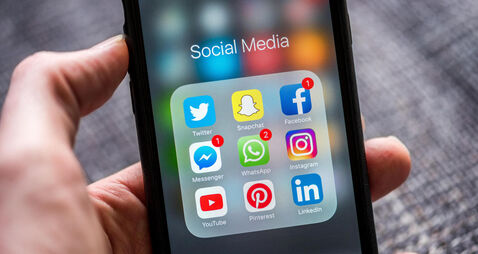 HKYCG7 Social media app icons displayed on Apple iPhone