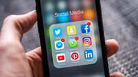 Social media app icons displayed on Apple iPhone