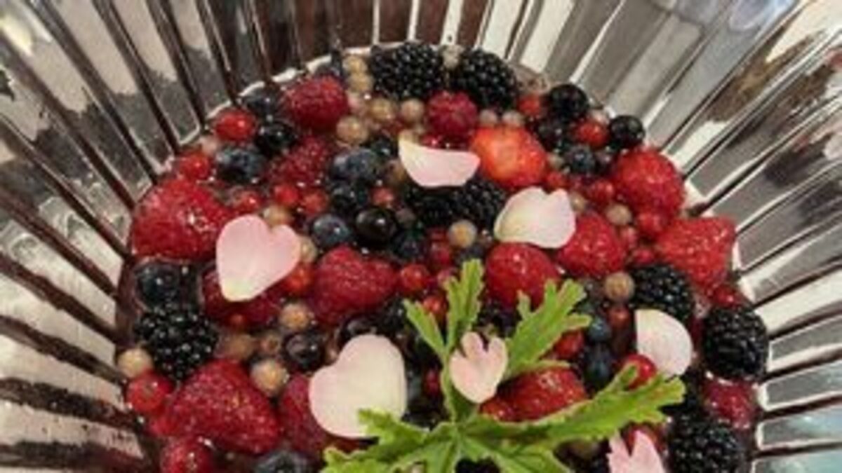 Summer currant and berry fruit salad with sweet geranium leaves